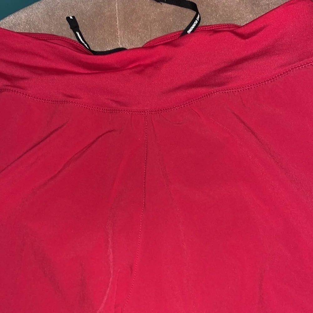 Nike raspberry colored Dri-Fit running shorts, medium, new